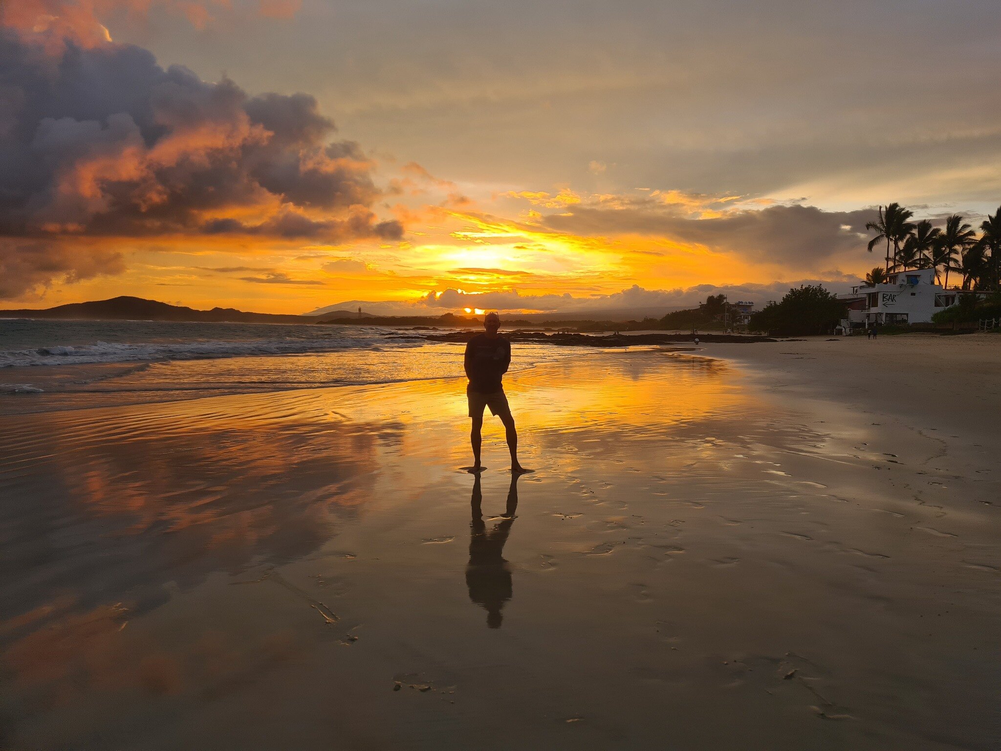 Evening light reflected across Puerto Villamil beach.